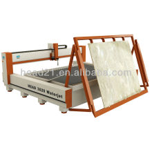 Waterjet cutting machine with glass loading system.